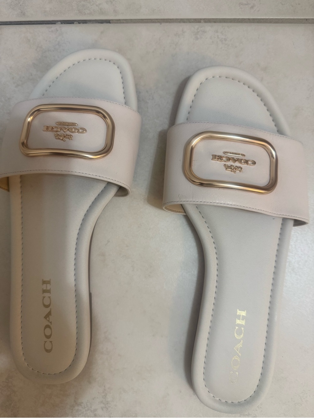 COACH Ivory Slide Sandals with Gold Buckle